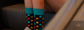 Casual everyday socks in pastel colors neatly folded on a white background.